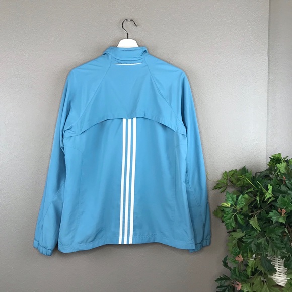 light blue adidas jacket with white stripes